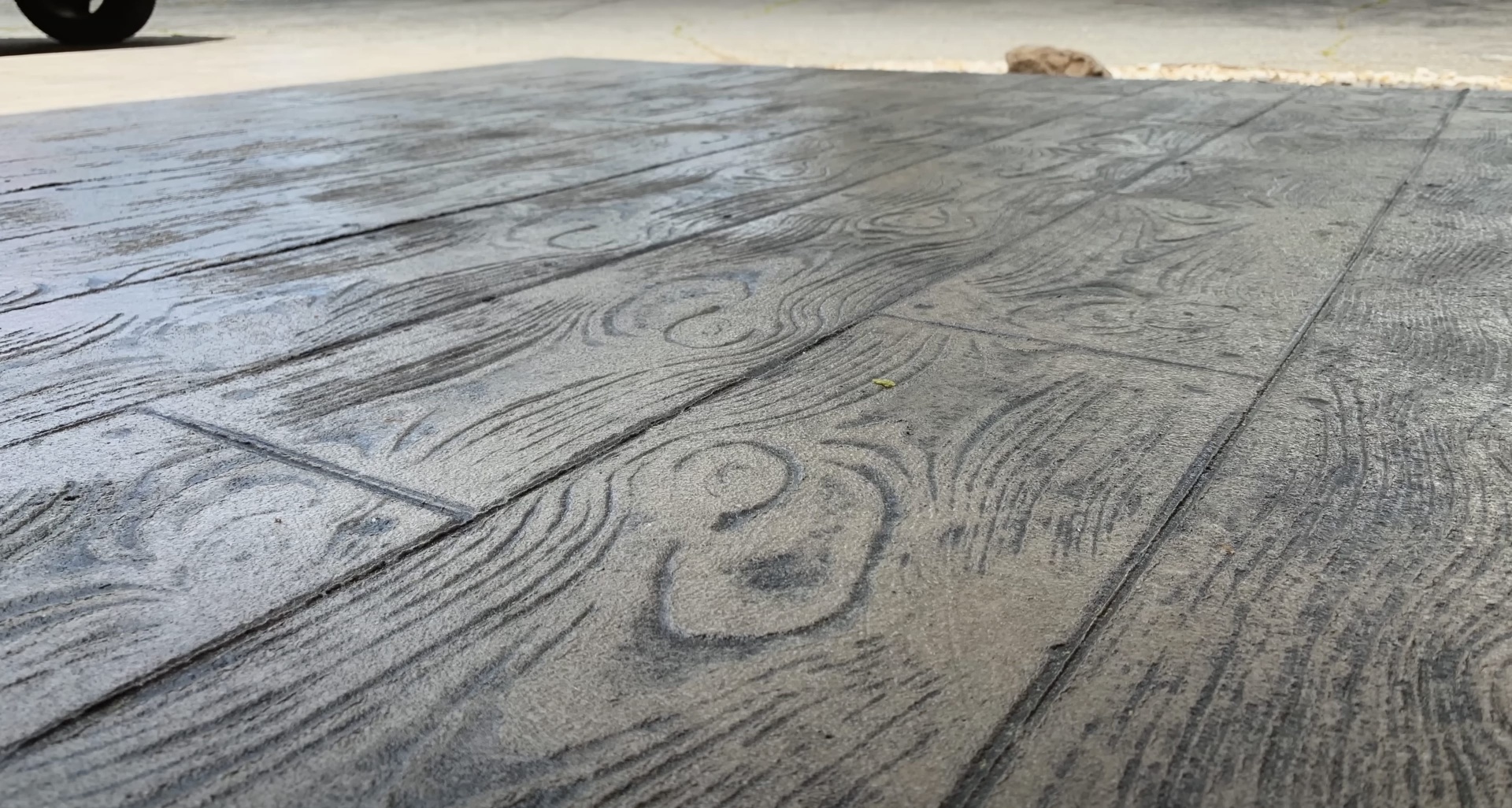 Beautifully stamped concrete with wood grain pattern showing expert craftsmanship