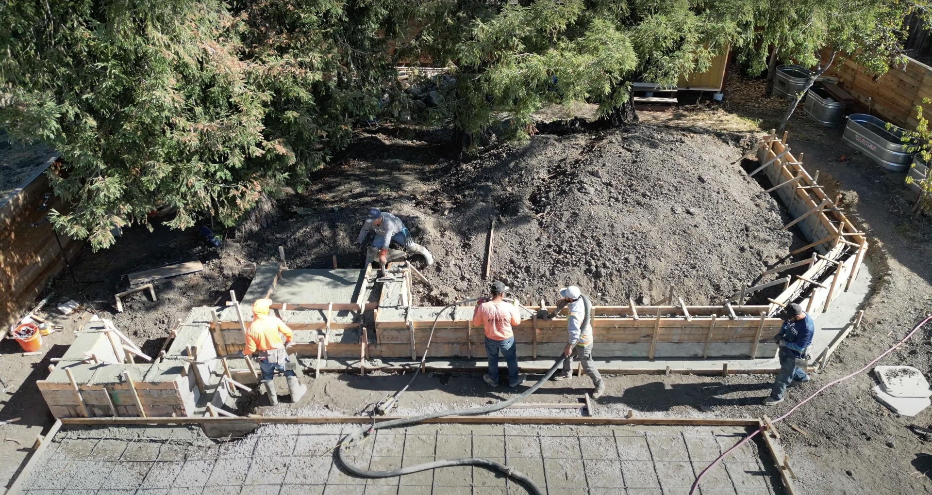 Large-scale concrete foundation construction project with professional crew and equipment