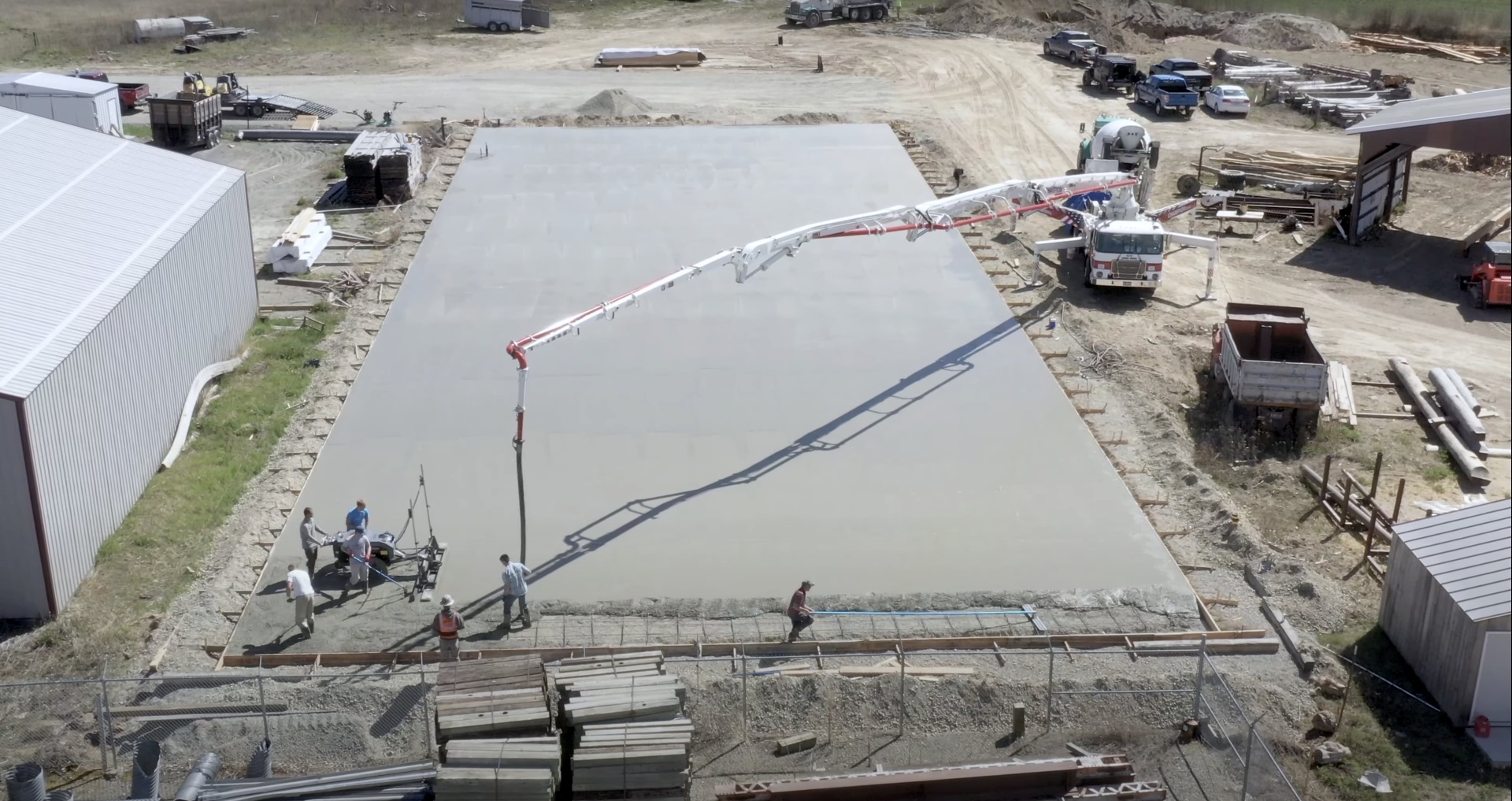 Large-scale concrete construction project with professional concrete pump truck