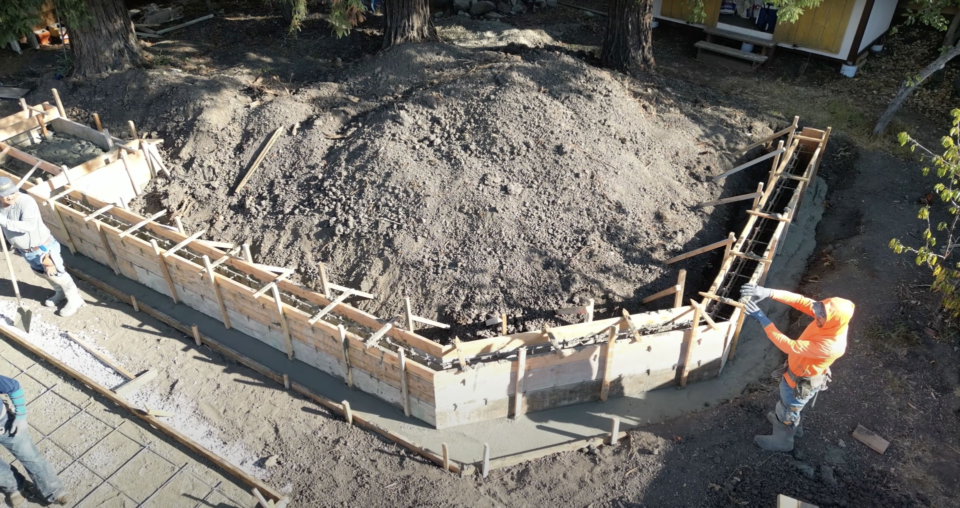 Concrete foundation preparation with wooden forms and rebar installation